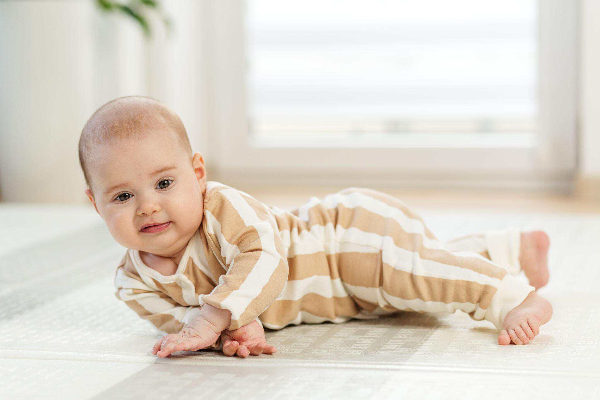 Baby developing crawling and mobility skills