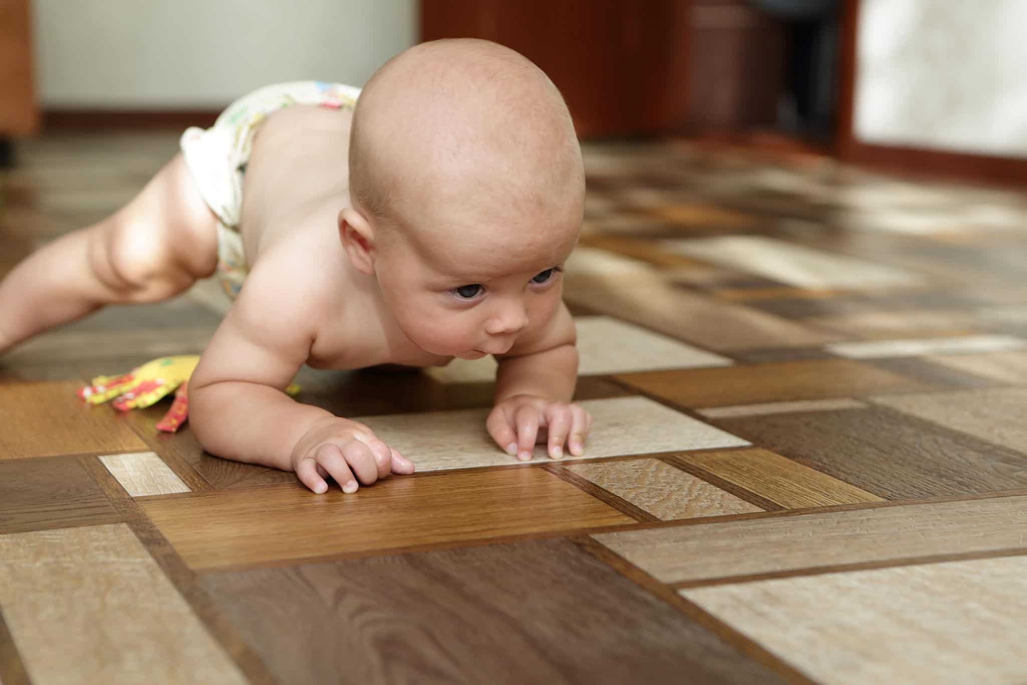 Four-month-old baby rolling over independently