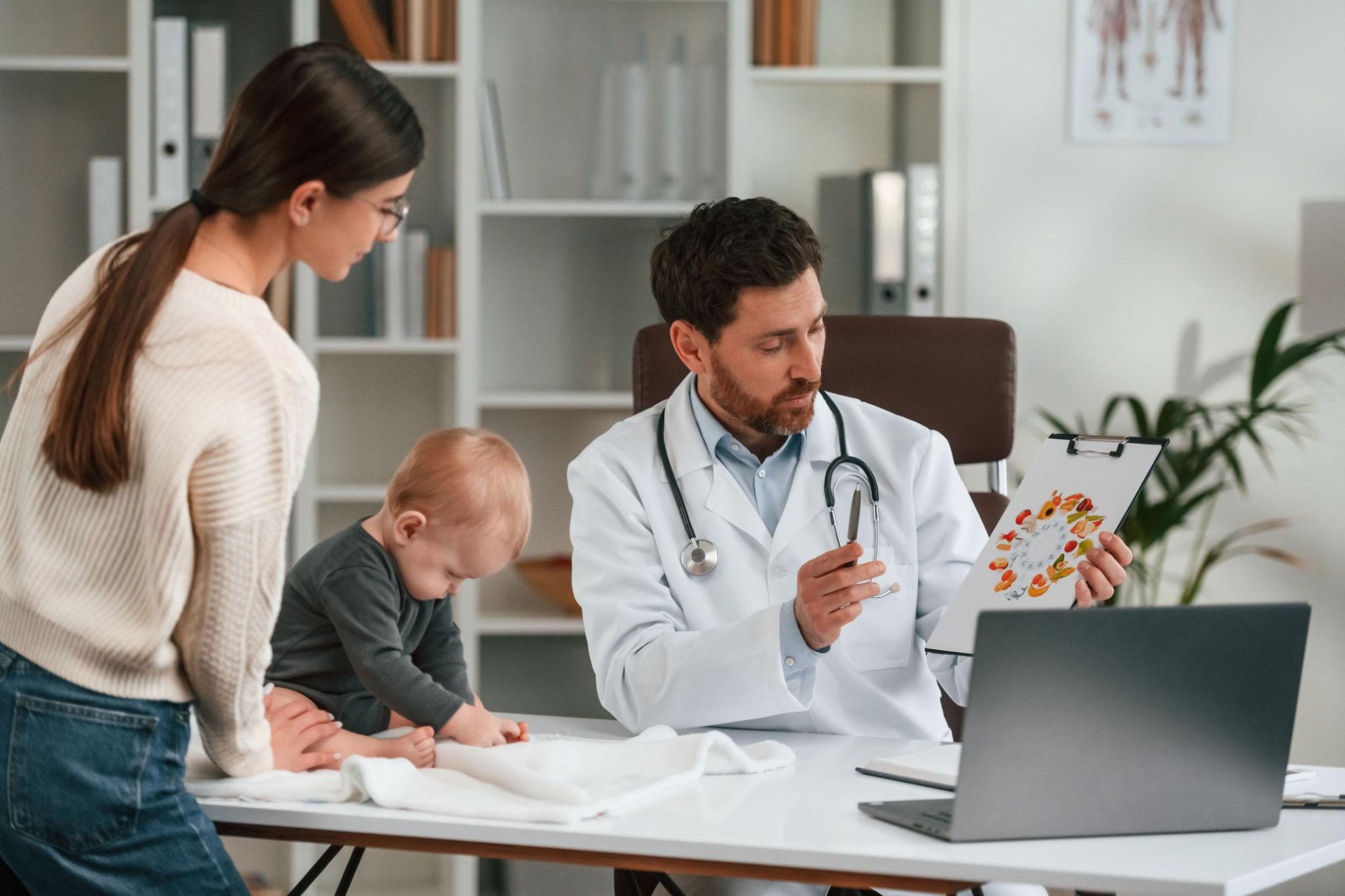 Pediatrician evaluating a baby with persistent diaper rash.